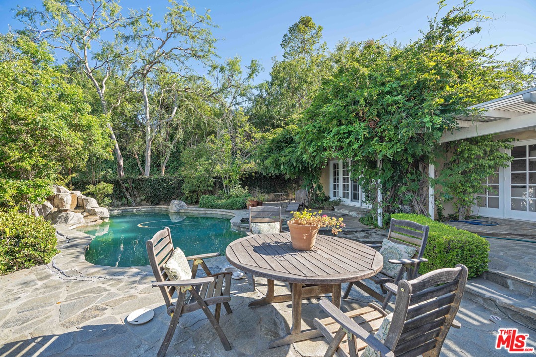 3710 Eureka Drive Studio City, CA 91604 - Photo 6 of 51 a view of a table and chairs in back yard of the house