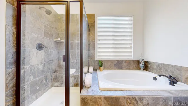 a bath tub sitting next to a window