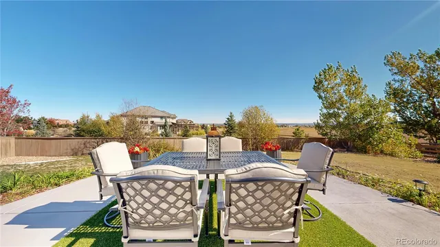 swimming pool view with a seating space