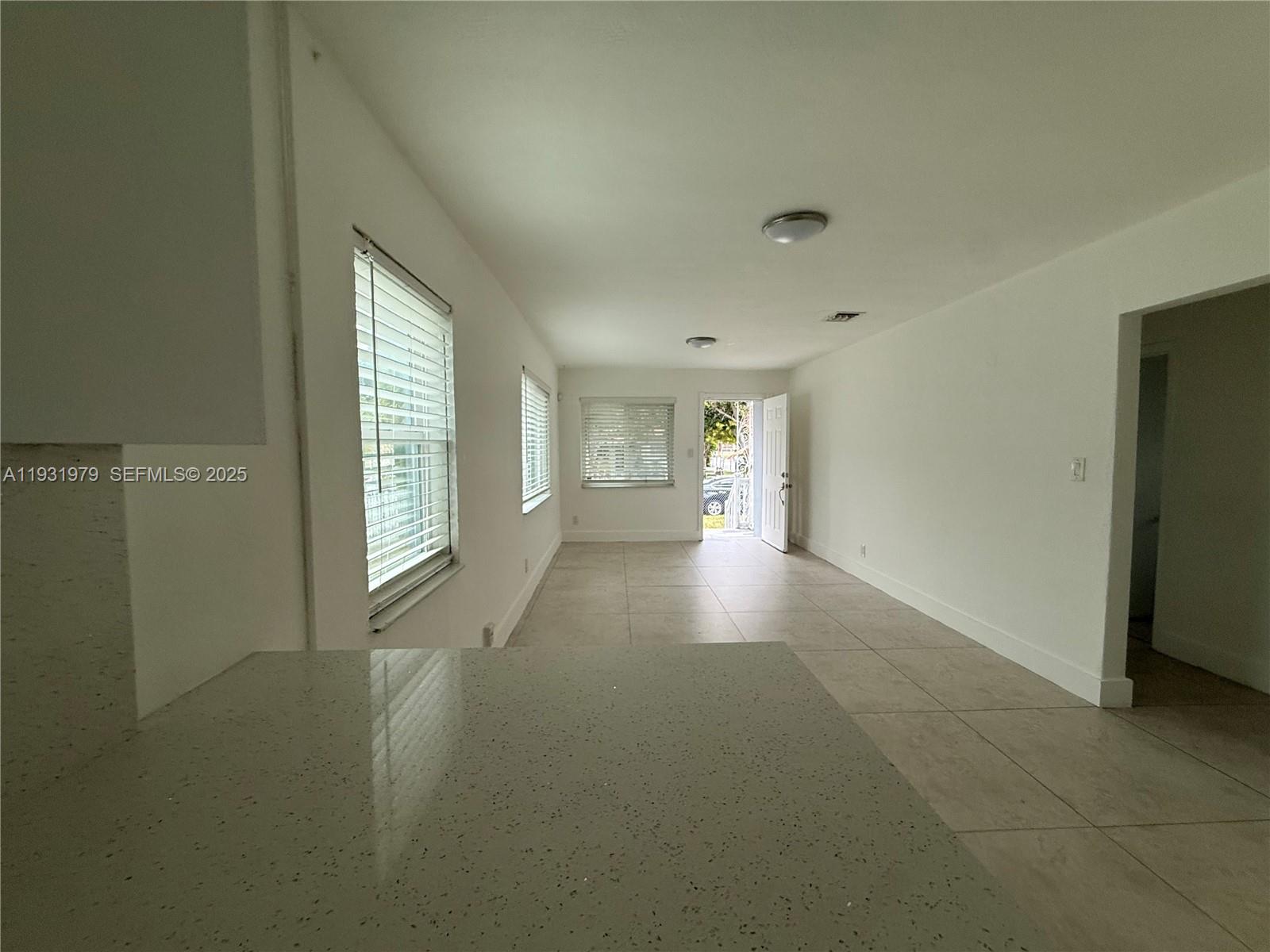 1448 Northeast 152nd Street North Miami Beach, FL 33162 - Photo 2 of 11 a view of livingroom with window