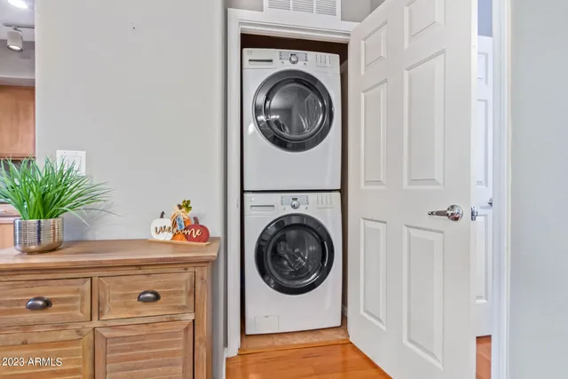 a utility room with sink dryer and washer