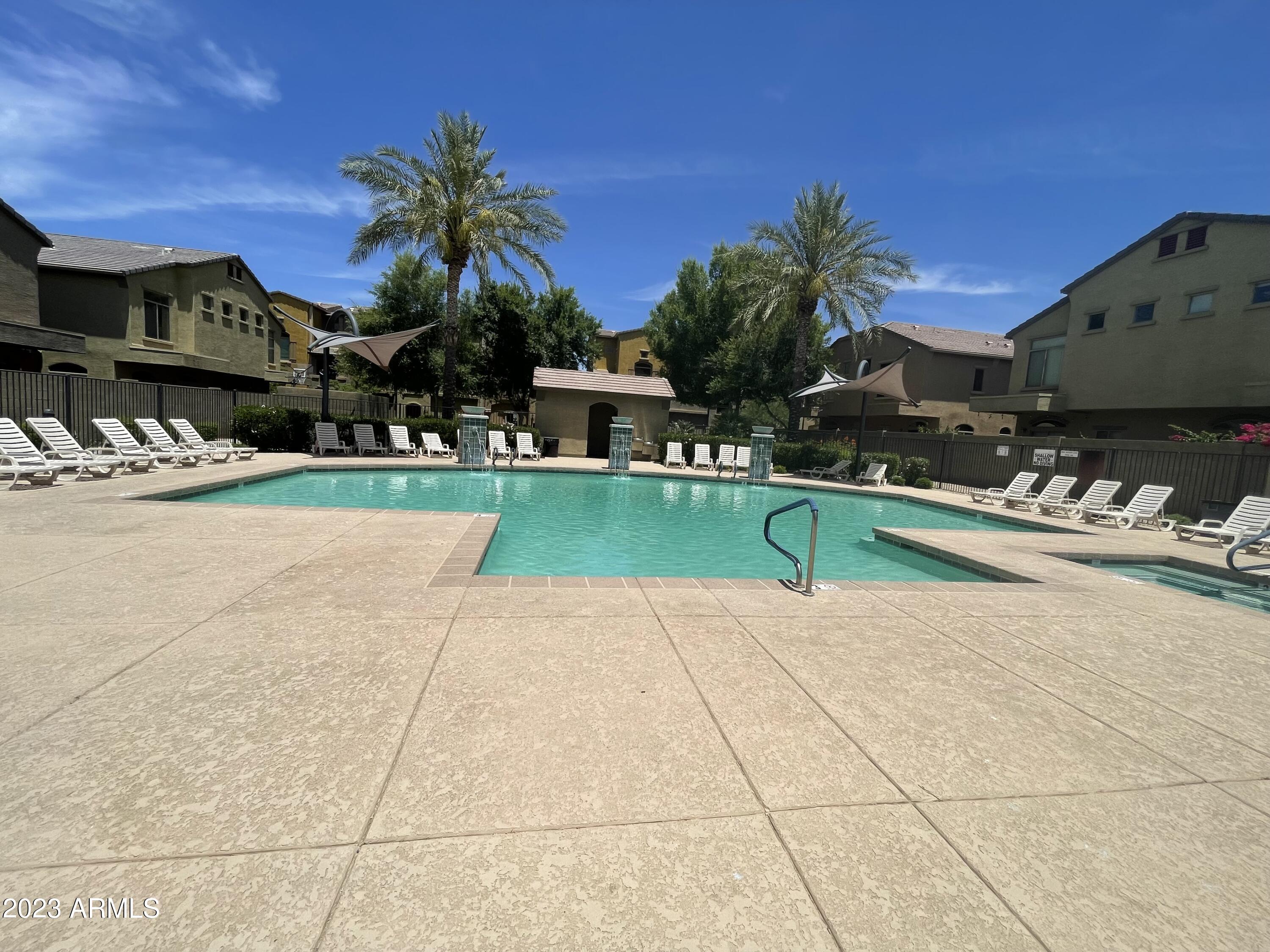 2150 West Alameda Road, Unit 1381 Phoenix, AZ 85085 - Photo 21 of 23 a house with a yard and a garden