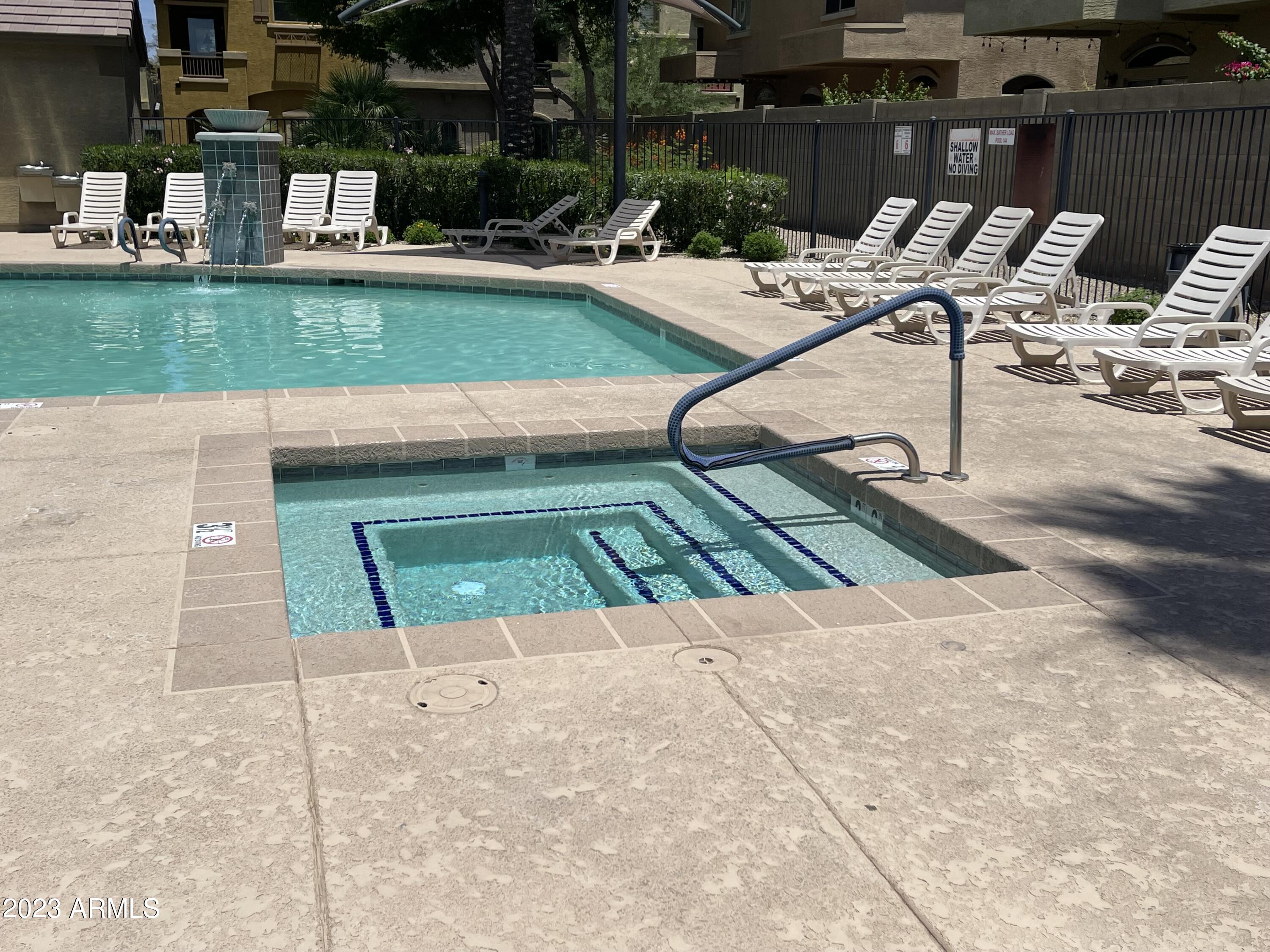 2150 West Alameda Road, Unit 1381 Phoenix, AZ 85085 - Photo 23 of 23 a view of swimming pool with a lounge chairs