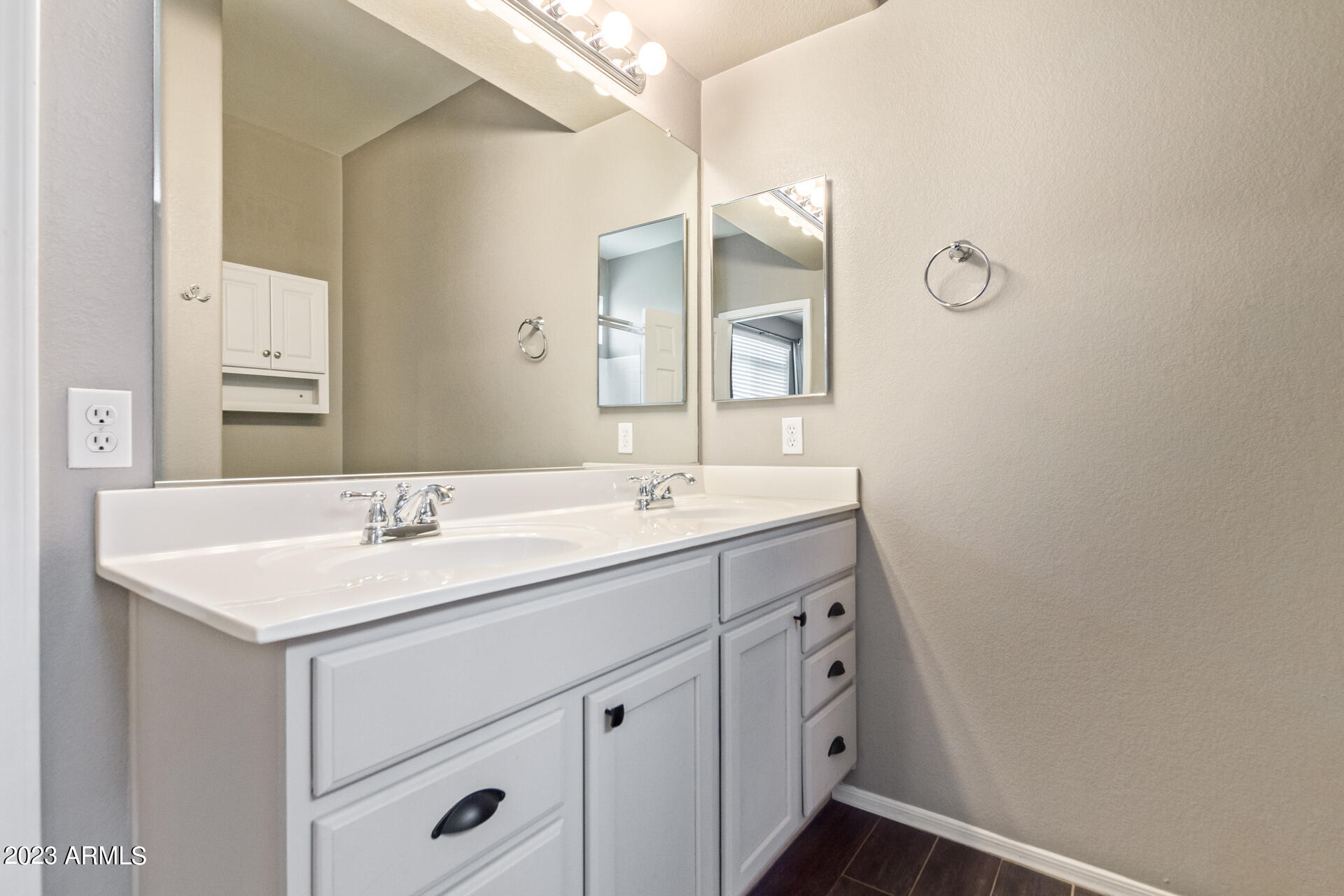 2150 West Alameda Road, Unit 1381 Phoenix, AZ 85085 - Photo 7 of 23 a bathroom with a sink a light fixture a vanity and a mirror