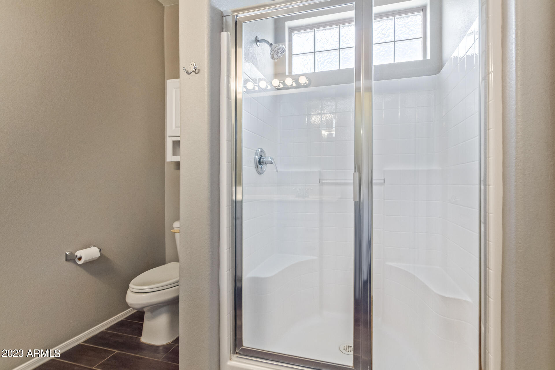 2150 West Alameda Road, Unit 1381 Phoenix, AZ 85085 - Photo 8 of 23 a bathroom with a granite countertop toilet a sink and a large mirror