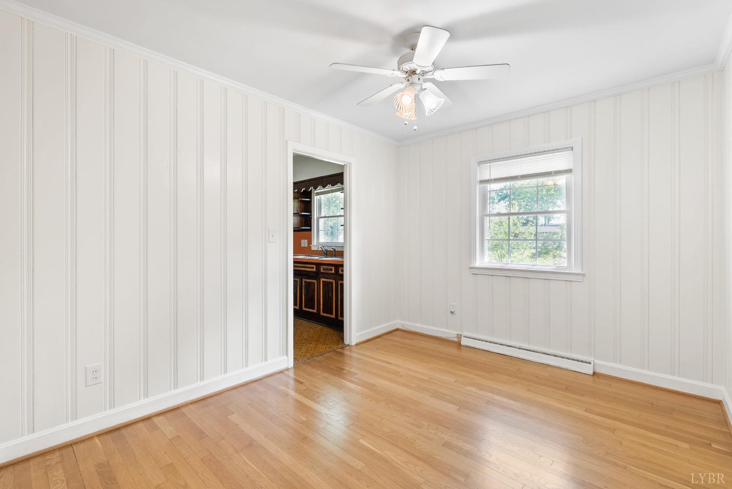 207 Ramsey Road Hurt, VA 24563 - Photo 14 of 32 wooden floor in an empty room with a window