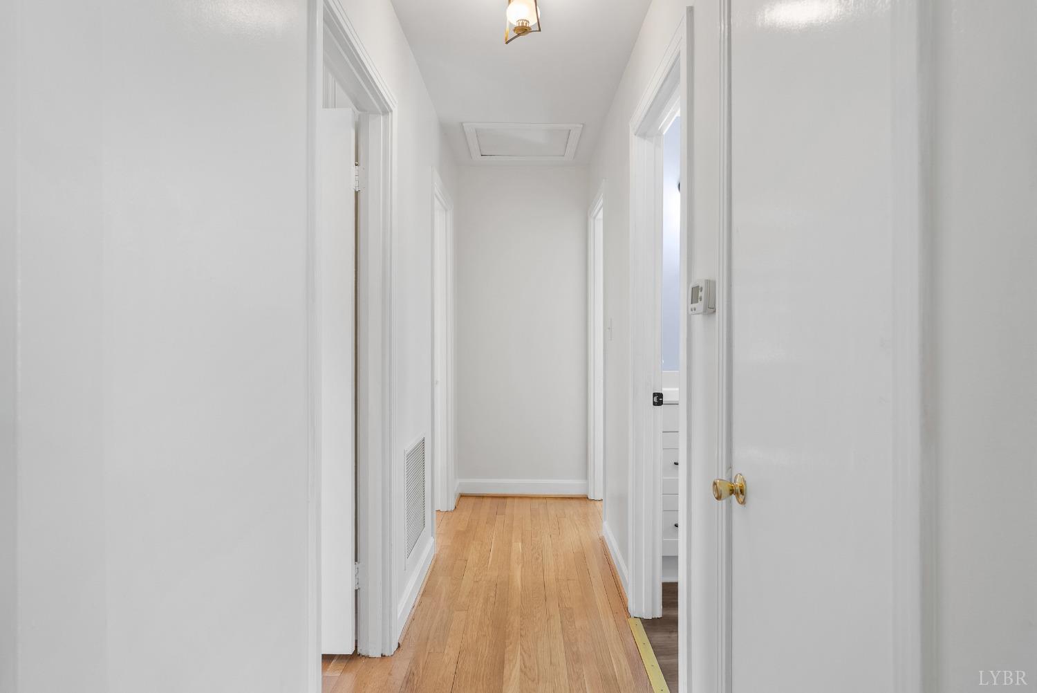 207 Ramsey Road Hurt, VA 24563 - Photo 15 of 32 a view of a hallway with wooden floor