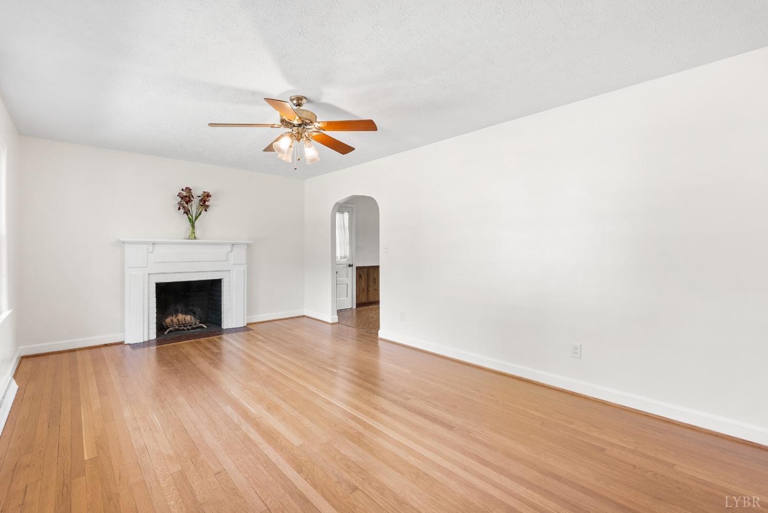 207 Ramsey Road Hurt, VA 24563 - Photo 5 of 32 a view of a livingroom with a fireplace and wooden floor