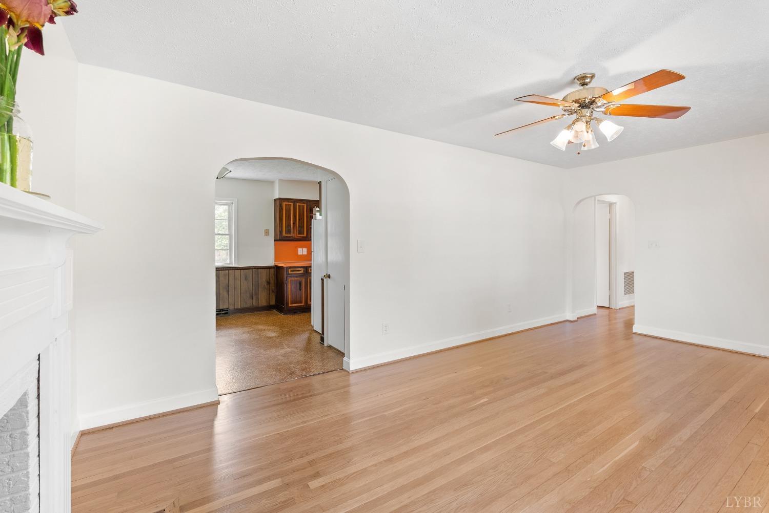 207 Ramsey Road Hurt, VA 24563 - Photo 6 of 32 wooden floor in an empty room with a window