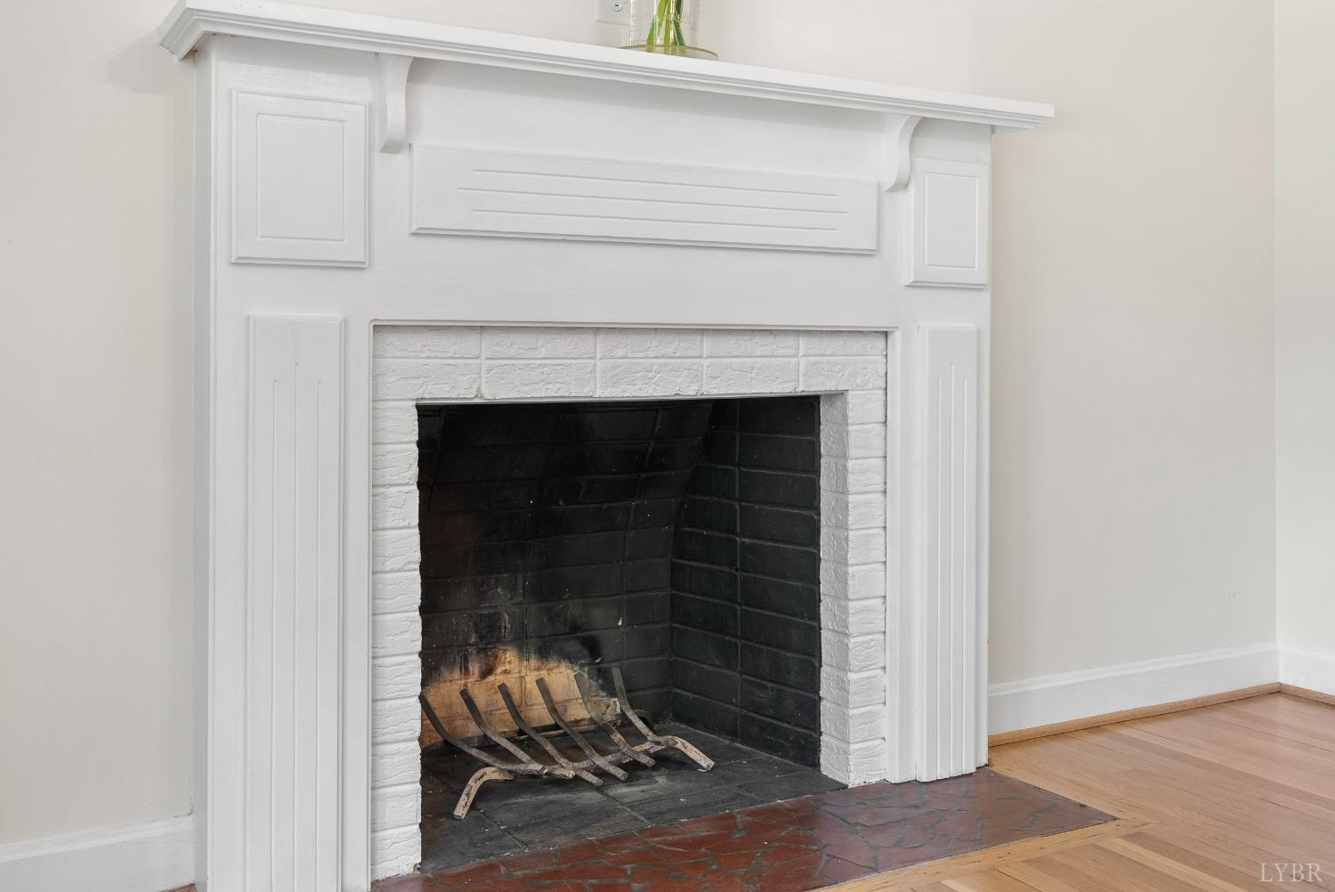 207 Ramsey Road Hurt, VA 24563 - Photo 7 of 32 a room with a fireplace and a fan