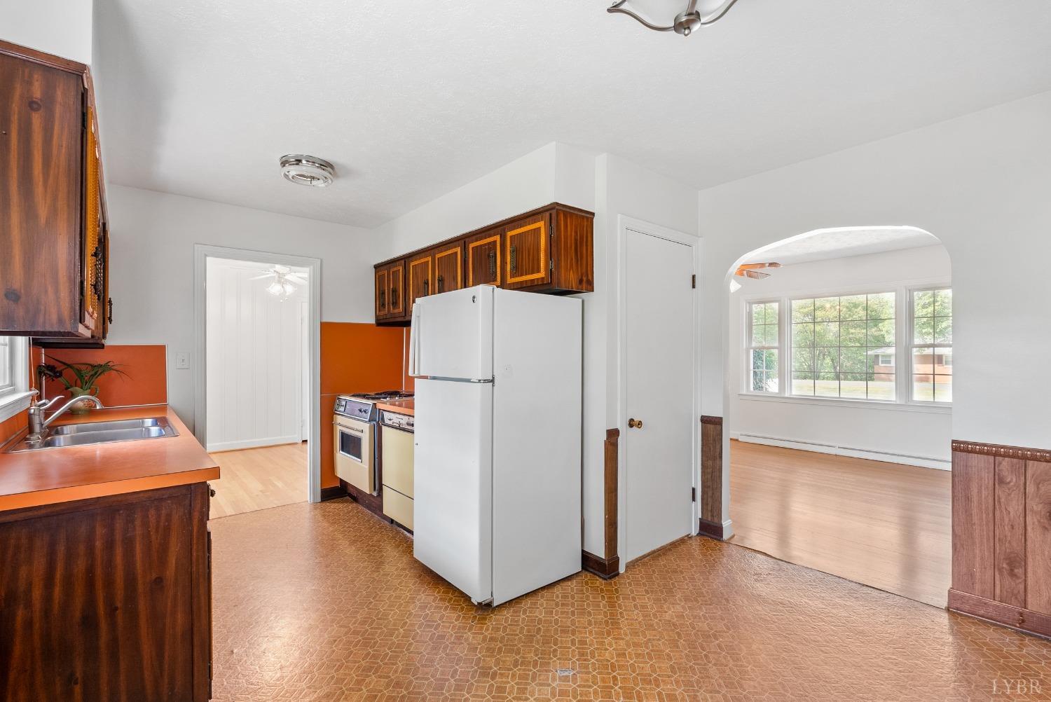 207 Ramsey Road Hurt, VA 24563 - Photo 9 of 32 a view of a kitchen with fridge and wooden floor