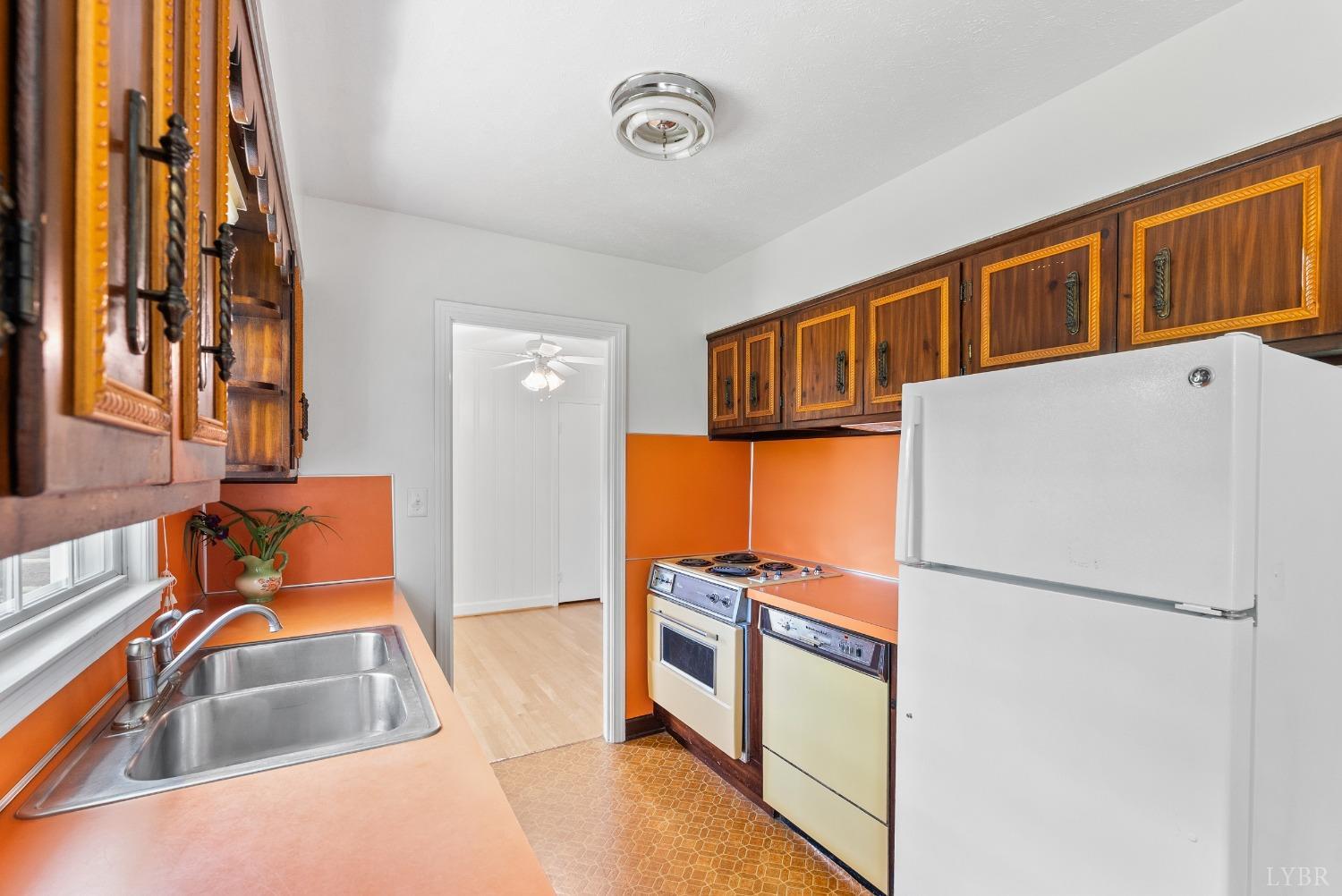 207 Ramsey Road Hurt, VA 24563 - Photo 10 of 32 a kitchen with stainless steel appliances granite countertop a refrigerator and a sink