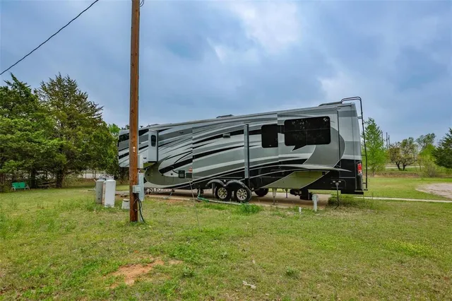 a view of a two chairs in the park