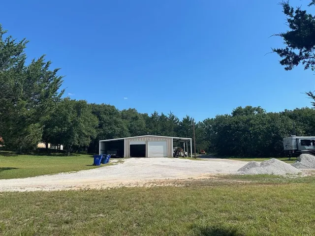 a house view with swimming pool in front of a house