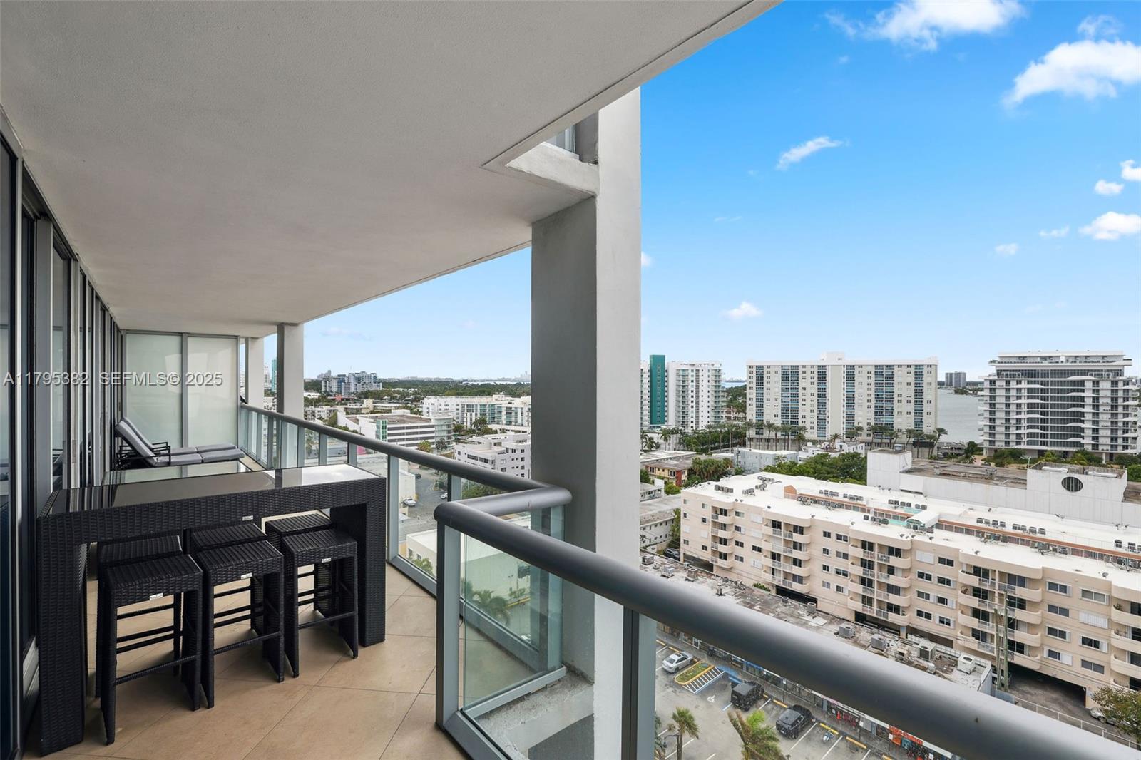 6799 Collins Avenue, Unit 1106 Miami Beach, FL 33141 - Photo 13 of 43 a view of a balcony with an ocean view