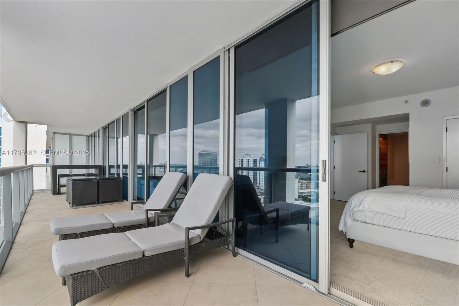 6799 Collins Avenue, Unit 1106 Miami Beach, FL 33141 - Photo 17 of 43 a living room with furniture