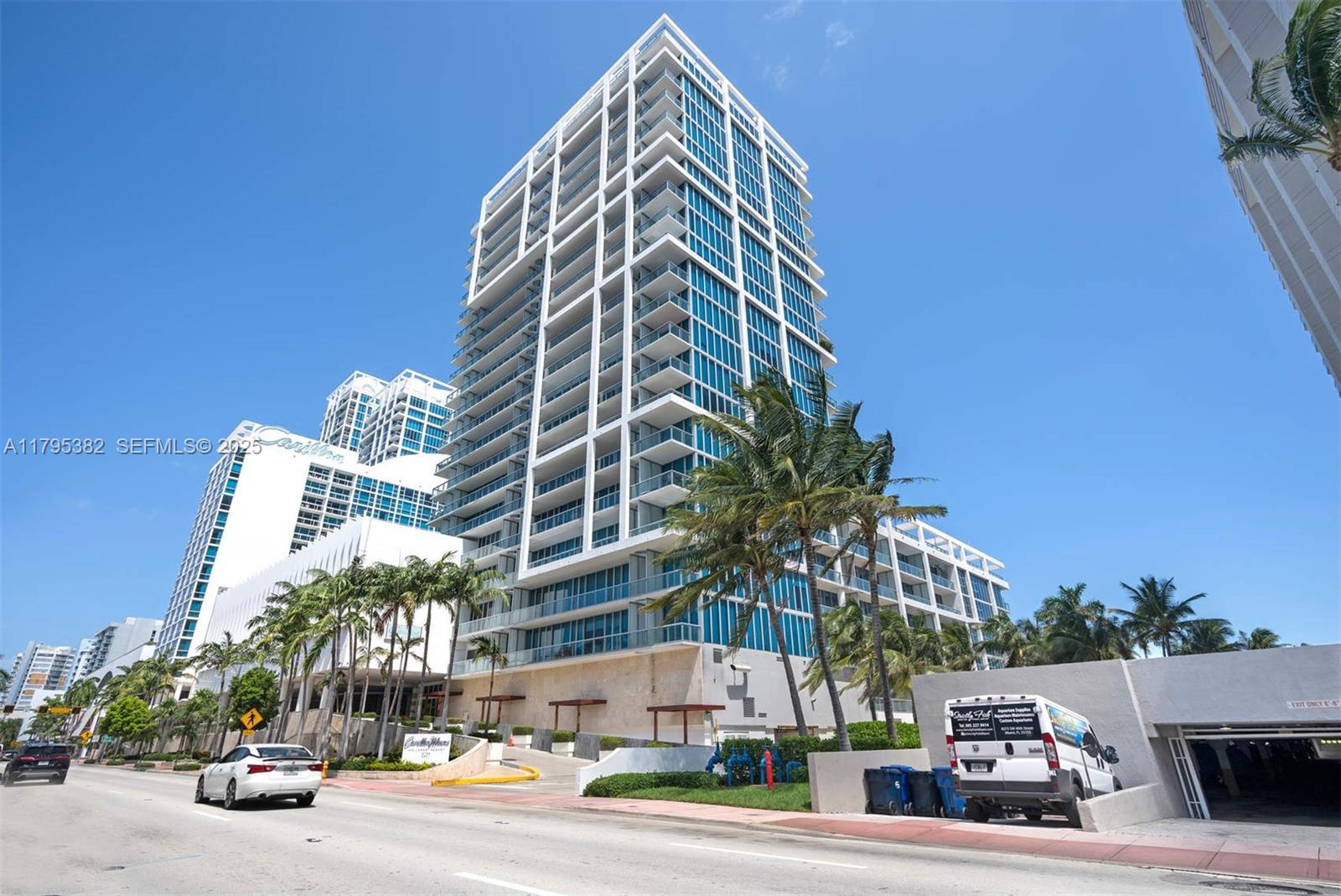 6799 Collins Avenue, Unit 1106 Miami Beach, FL 33141 - Photo 32 of 43 a view of a tall building next to a road