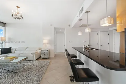 a living room with furniture and a lamp