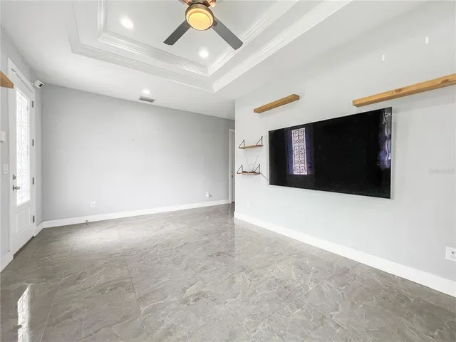 a view of an empty room with a flat screen tv