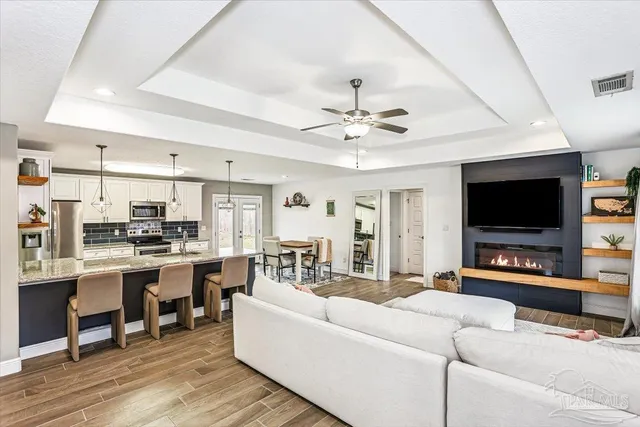 a living room with furniture and a flat screen tv