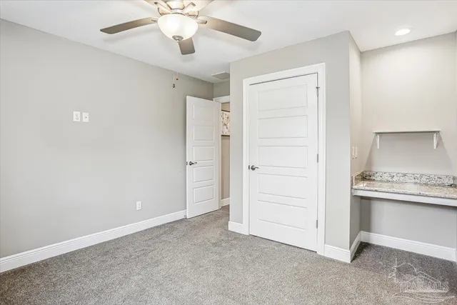 a view of cabinets and window in a room