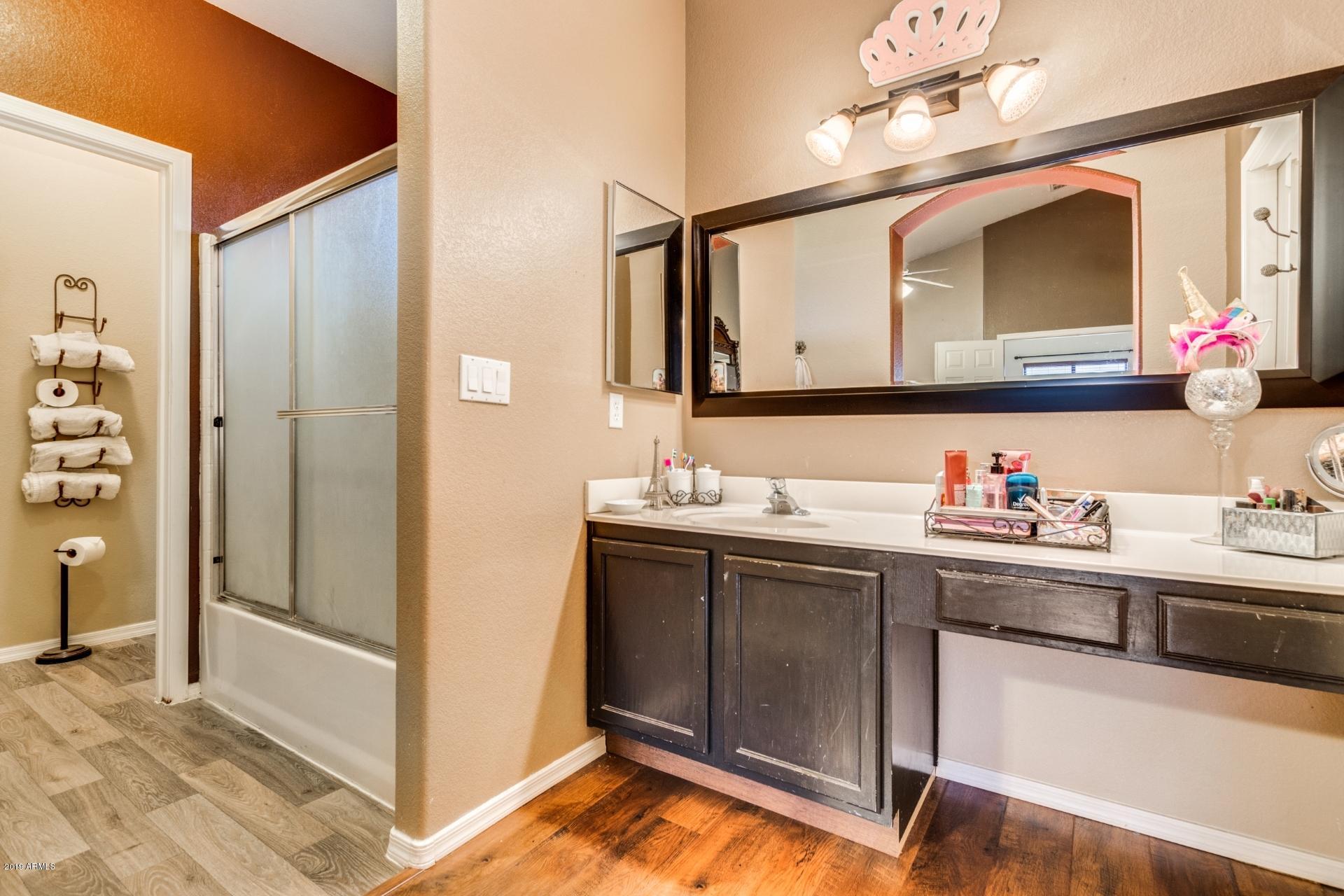 10434 East Bonnell Street Apache Junction, AZ 85120 - Photo 19 of 21 a bathroom with a sink and a mirror