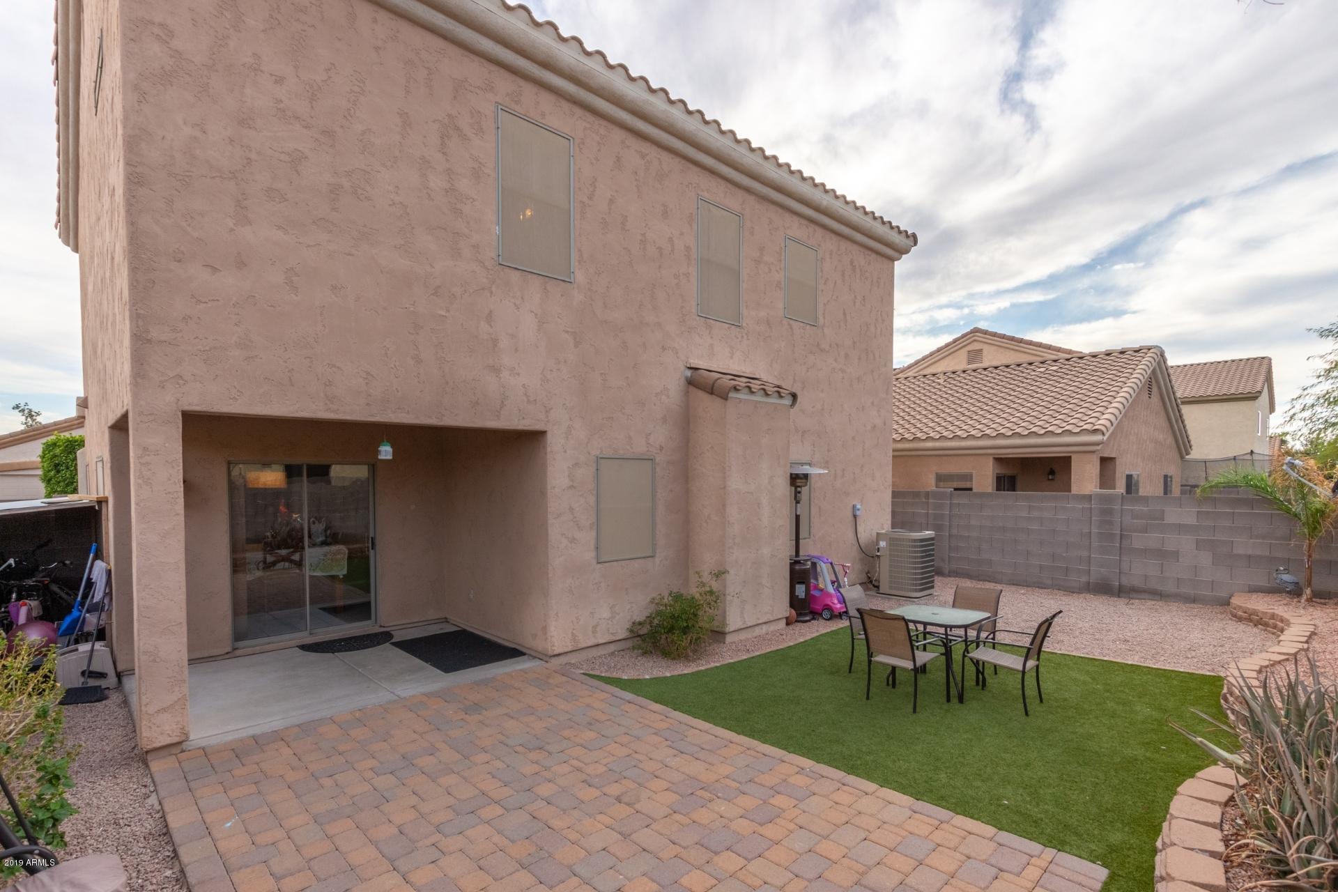 10434 East Bonnell Street Apache Junction, AZ 85120 - Photo 21 of 21 a view of a backyard with a garden and chairs