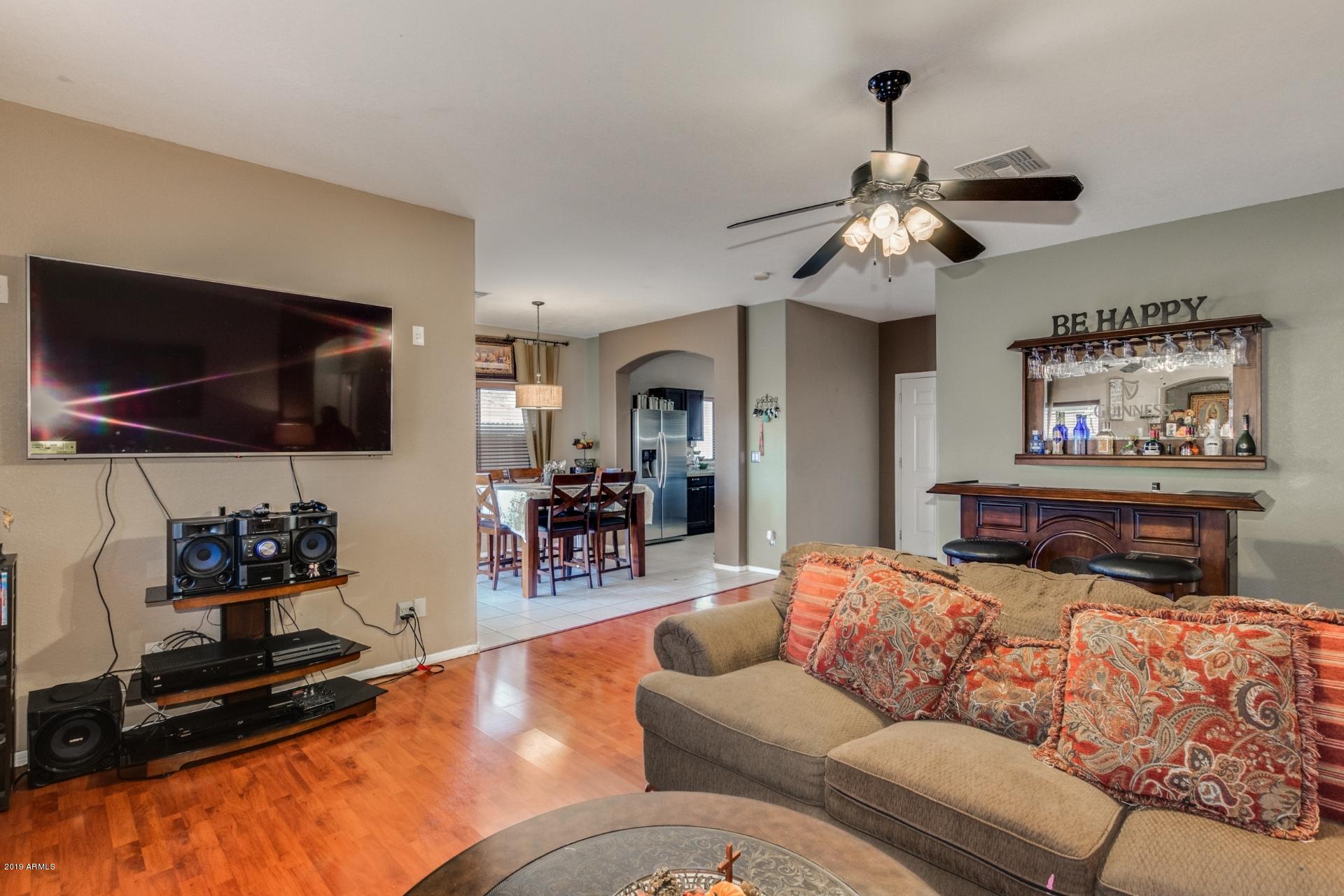10434 East Bonnell Street Apache Junction, AZ 85120 - Photo 6 of 21 a living room with furniture and a flat screen tv