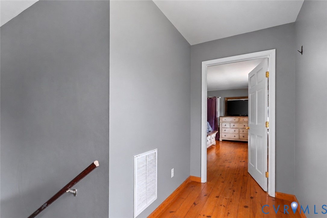80 Mill Ridge Road Hartfield, VA 23071 - Photo 13 of 43 Wood-finish flooring with a white paneled door