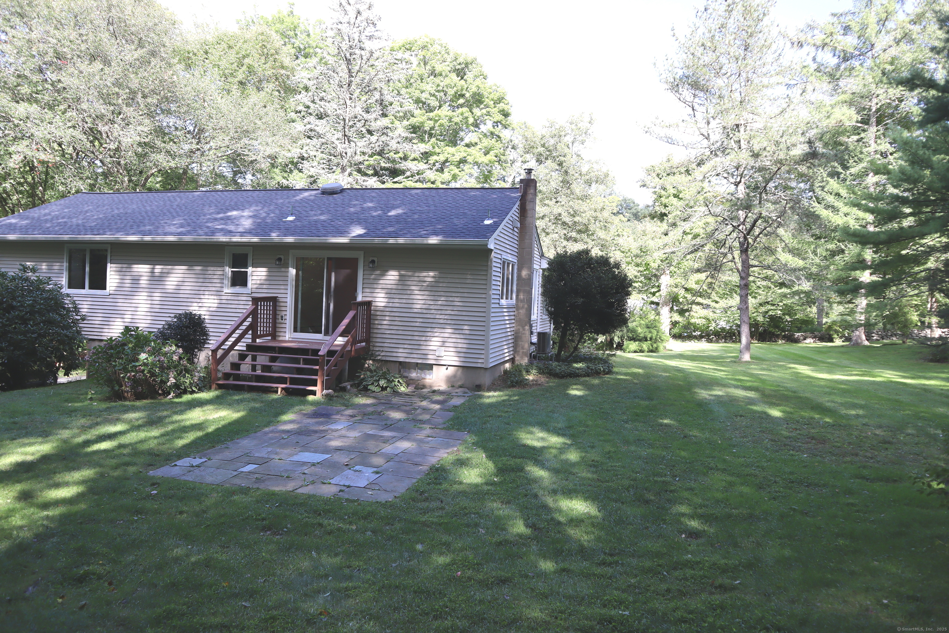 151 Chestnut Ridge Road Bethel, CT 06801 - Photo 21 of 23 a view of a house with backyard