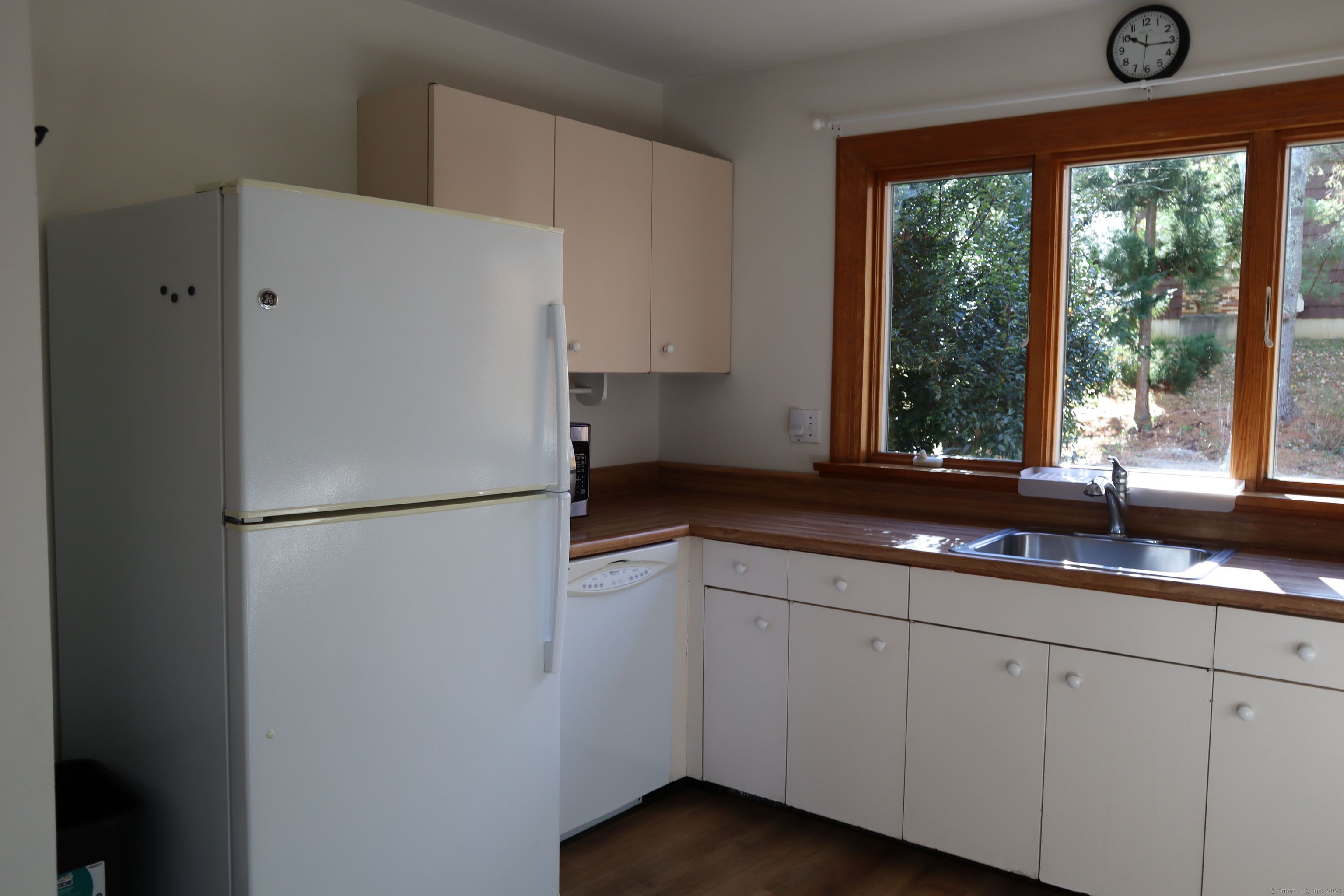 151 Chestnut Ridge Road Bethel, CT 06801 - Photo 8 of 23 a white refrigerator freezer sitting inside of a kitchen
