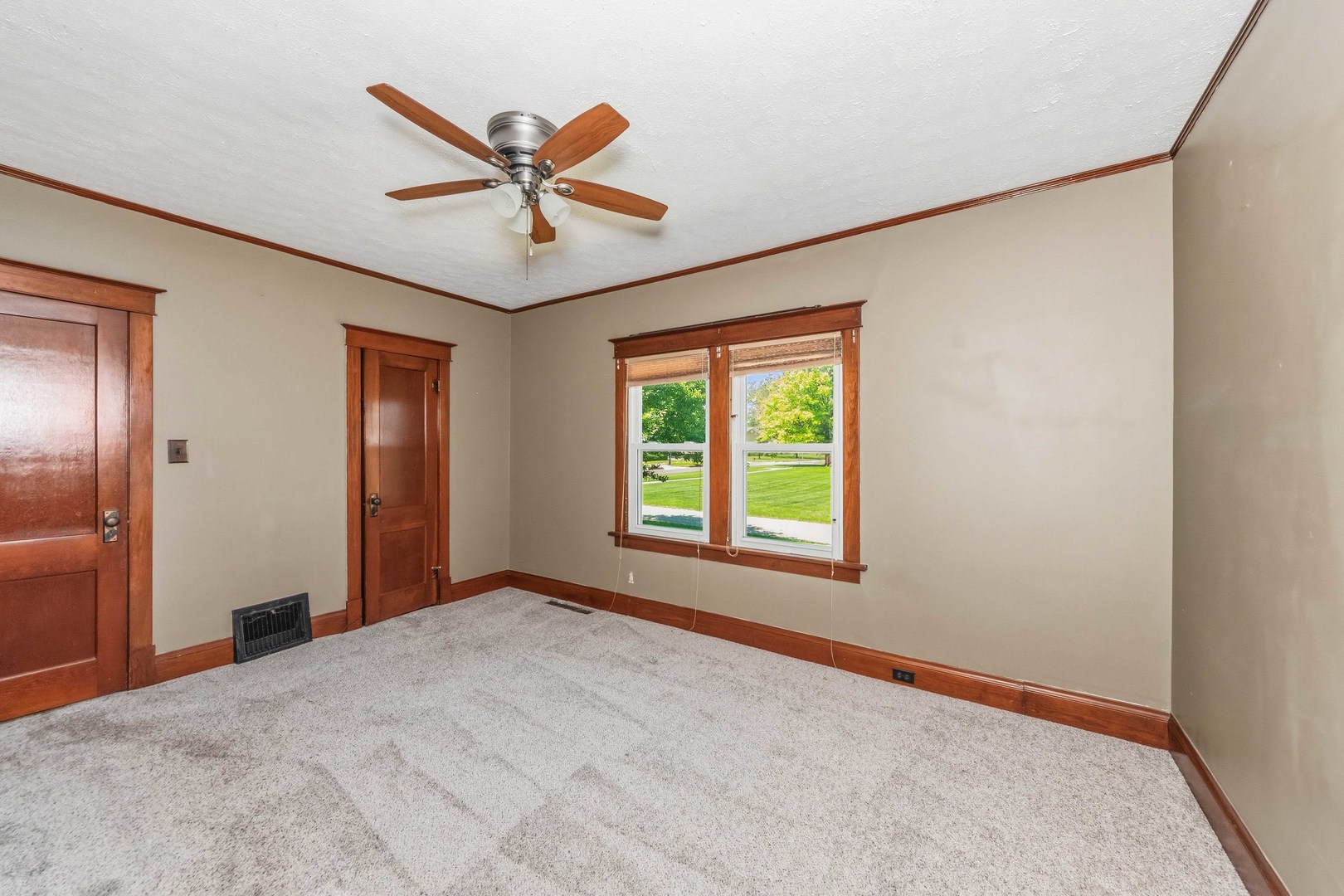 412 West 5th Street Minonk, IL 61760 - Photo 14 of 23 an empty room with window and ceiling fan