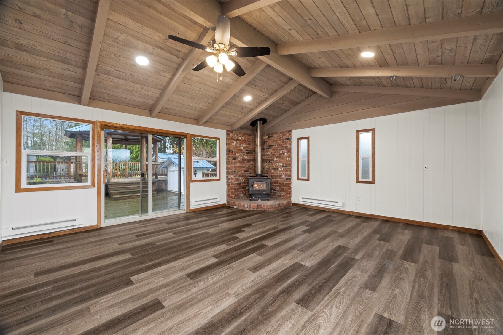 21275 Lafayette Road Sedro-Woolley, WA 98284 - Photo 11 of 40 a view of an empty room with wooden floor and a window