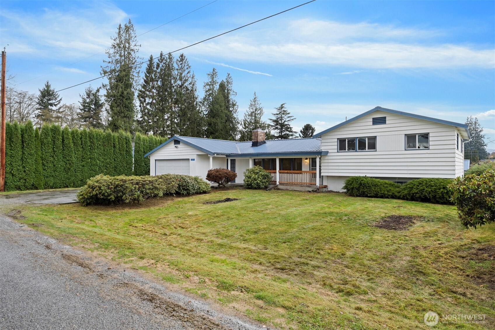 21275 Lafayette Road Sedro-Woolley, WA 98284 - Photo 2 of 40 a front view of a house with a garden
