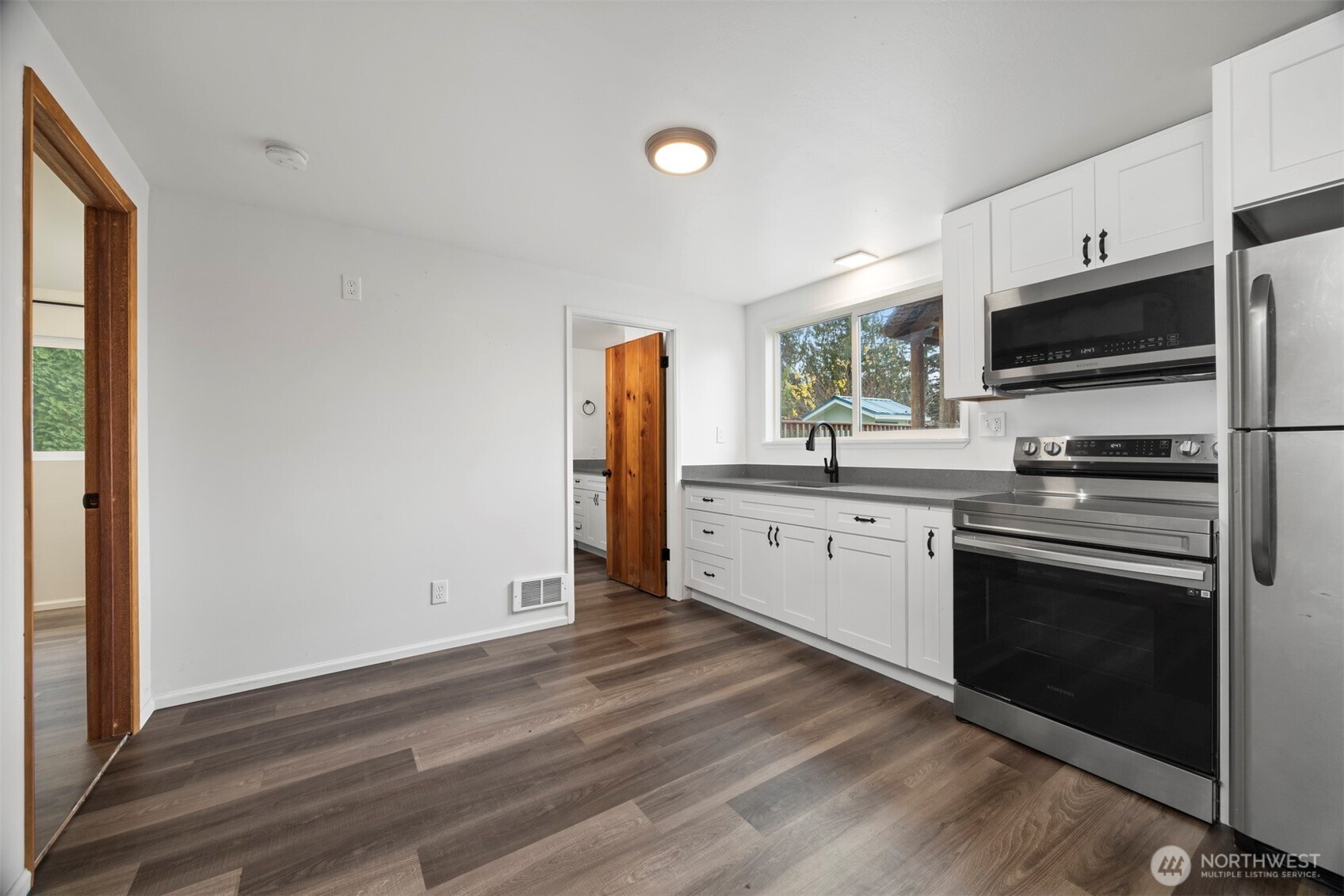 21275 Lafayette Road Sedro-Woolley, WA 98284 - Photo 22 of 40 a kitchen with stainless steel appliances a stove microwave and sink