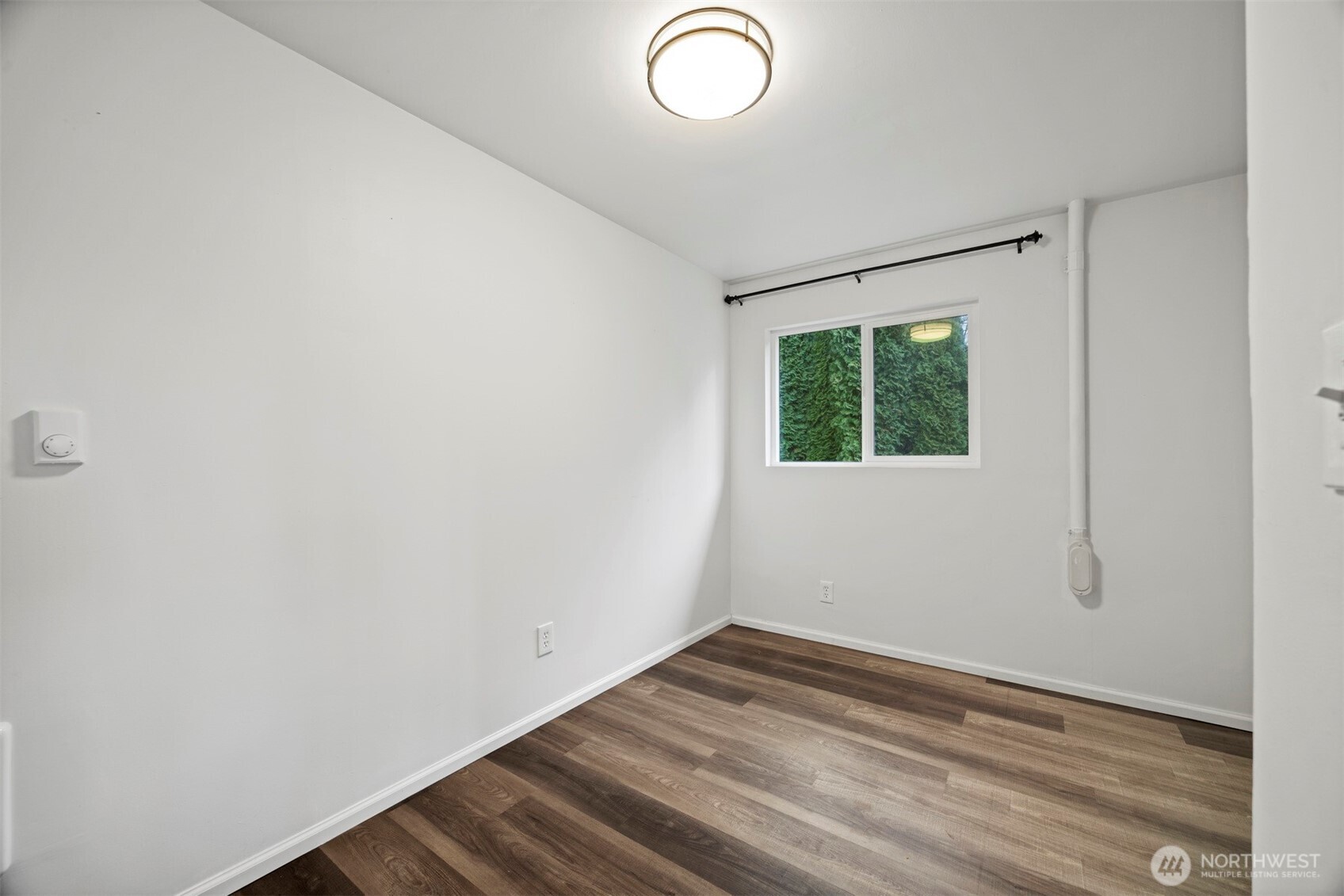 21275 Lafayette Road Sedro-Woolley, WA 98284 - Photo 25 of 40 a view of a room that has wooden floor and fan