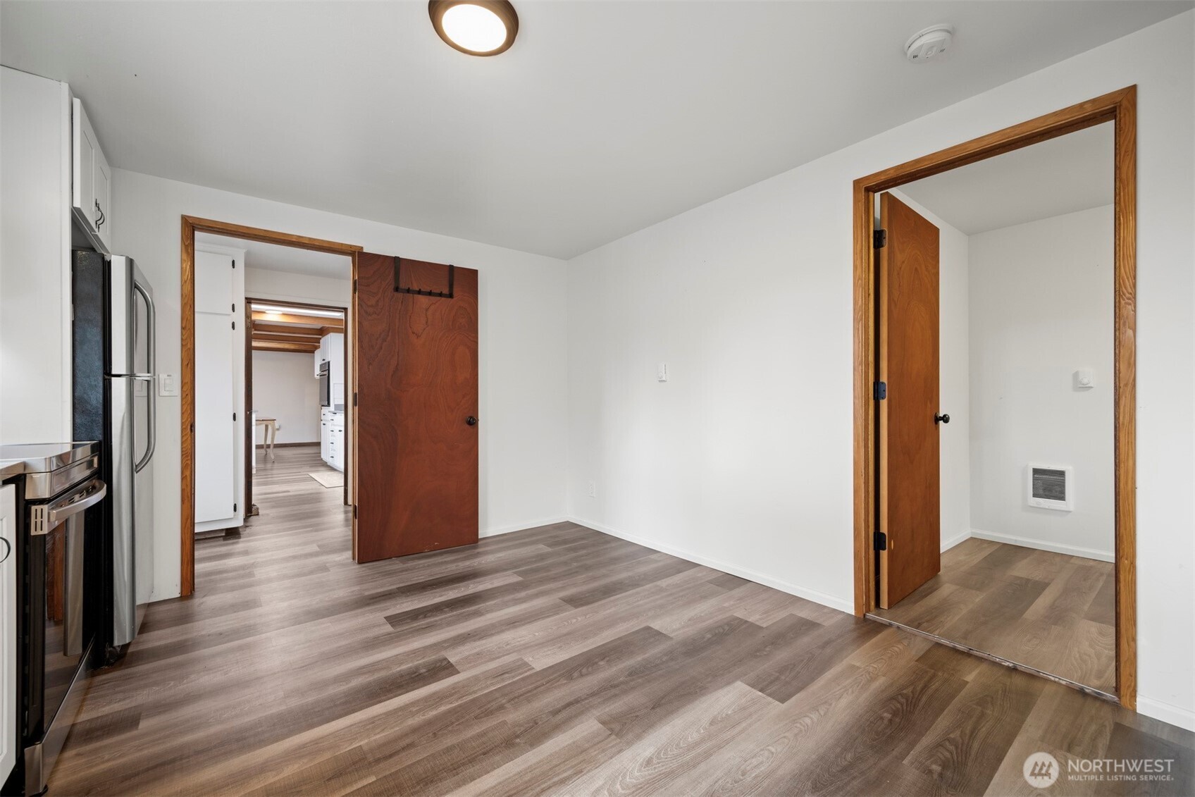 21275 Lafayette Road Sedro-Woolley, WA 98284 - Photo 27 of 40 a view of a hallway with wooden floor and closet
