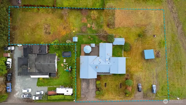 an aerial view of residential house with outdoor space and swimming pool