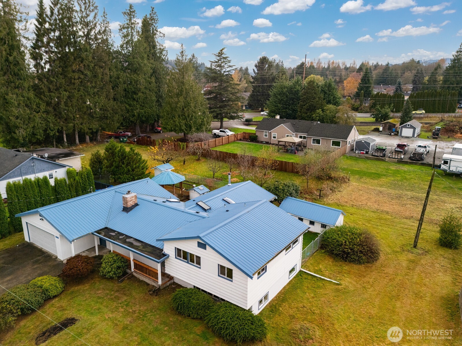 21275 Lafayette Road Sedro-Woolley, WA 98284 - Photo 36 of 40 a aerial view of a house with swimming pool and yard