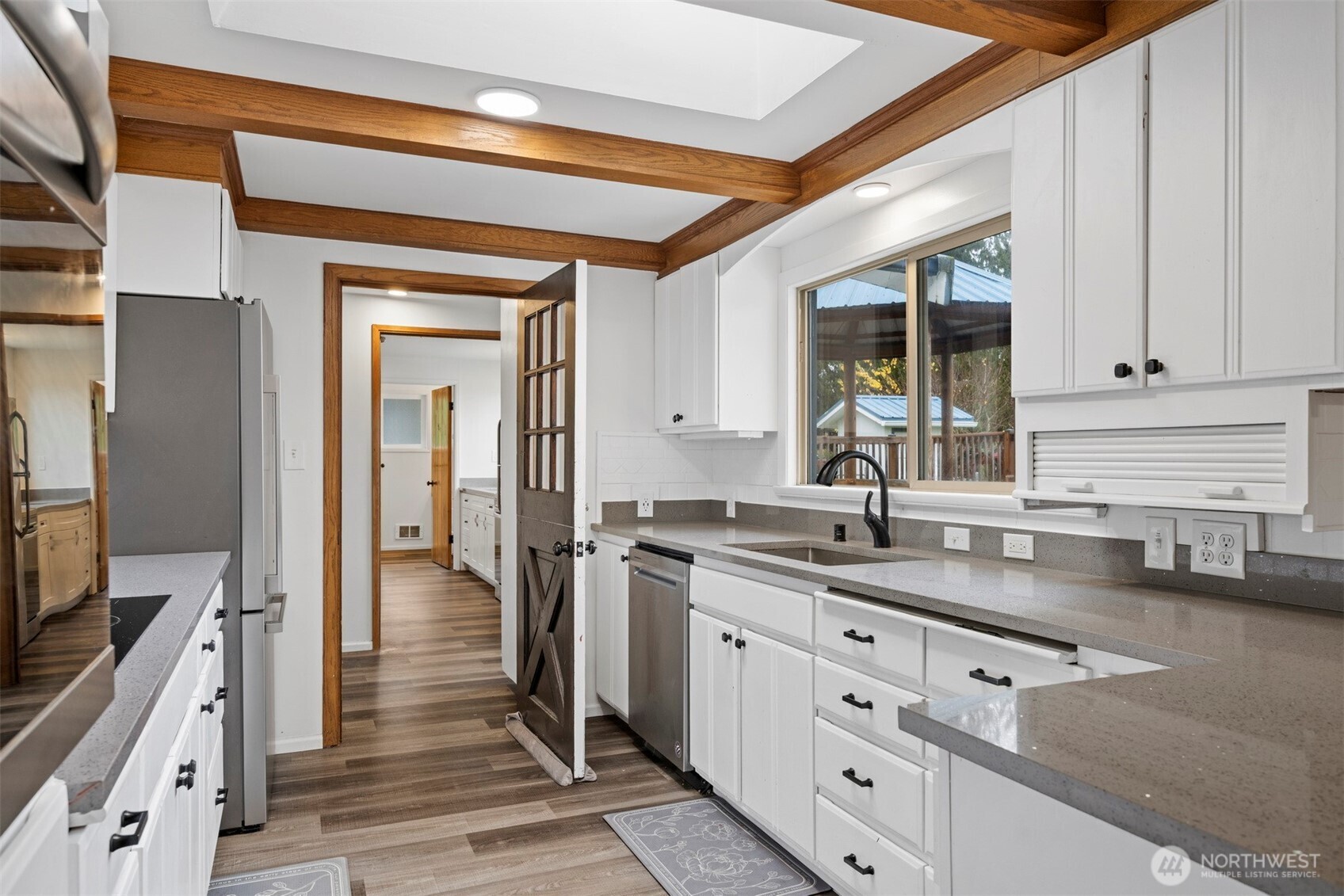 21275 Lafayette Road Sedro-Woolley, WA 98284 - Photo 6 of 40 a kitchen with granite countertop a sink stove and cabinets