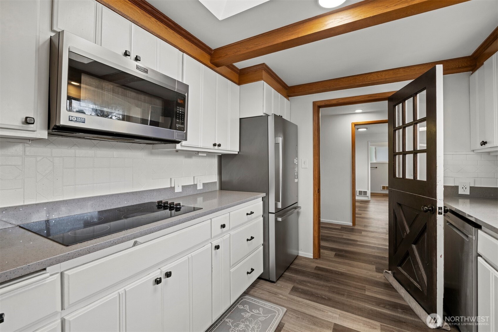 21275 Lafayette Road Sedro-Woolley, WA 98284 - Photo 7 of 40 a kitchen with stainless steel appliances a stove a microwave and a refrigerator