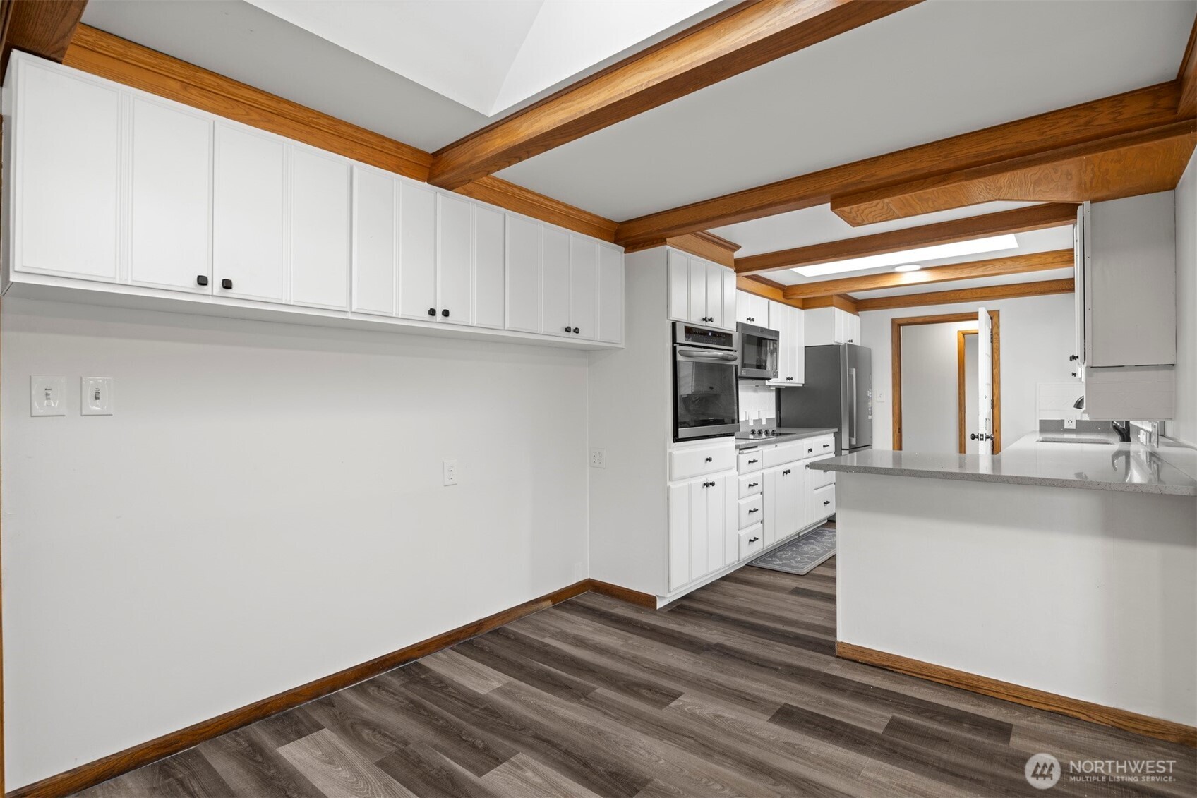 21275 Lafayette Road Sedro-Woolley, WA 98284 - Photo 8 of 40 a view of kitchen with wooden floor and electronic appliances