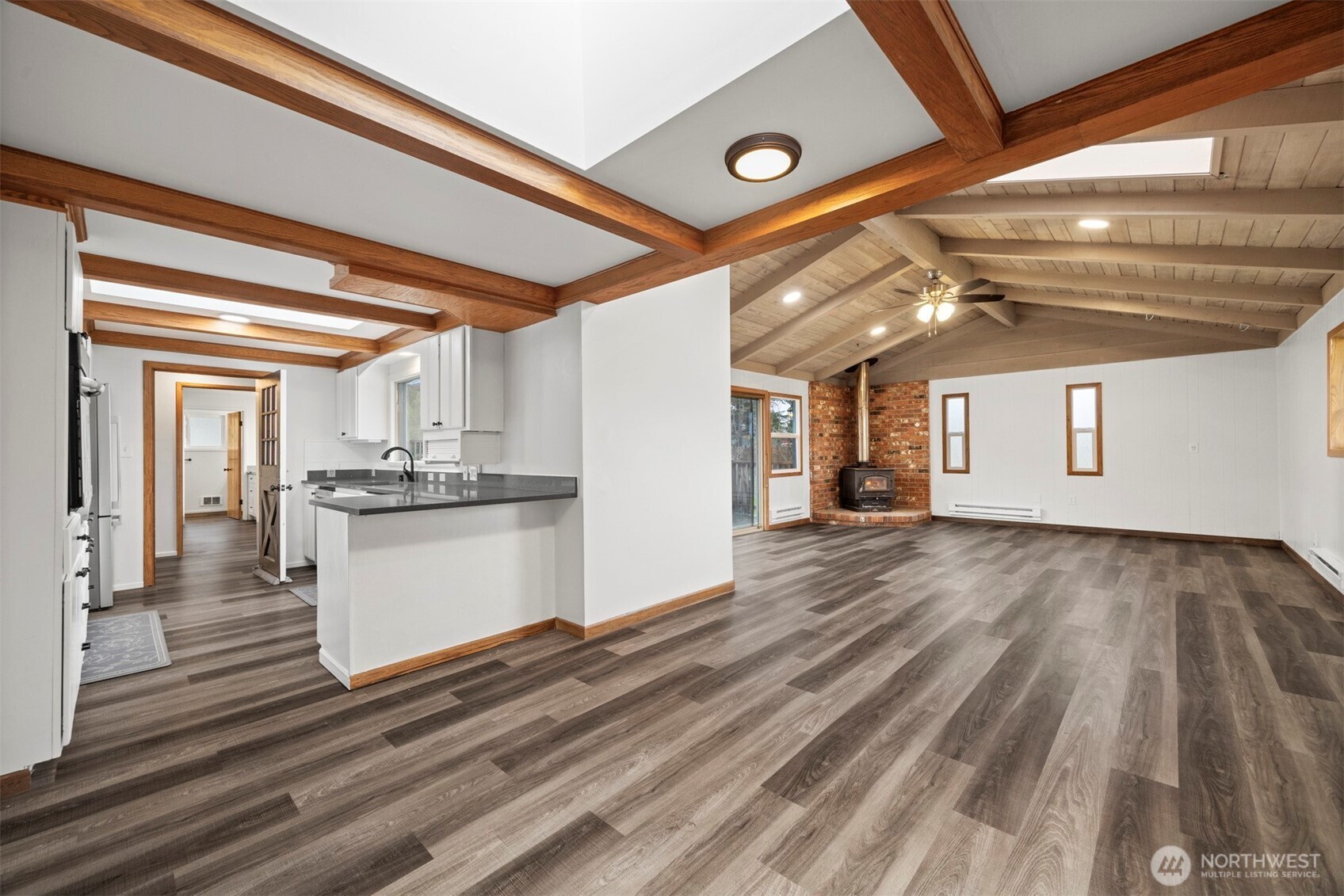 21275 Lafayette Road Sedro-Woolley, WA 98284 - Photo 9 of 40 a view of a kitchen with wooden floor and electronic appliances