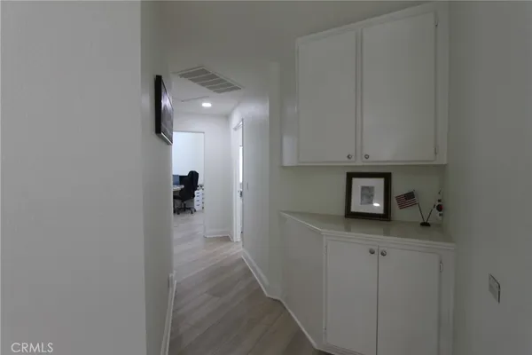 a view of a kitchen from the hallway