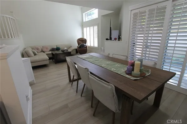 a view of a dining room with furniture and window