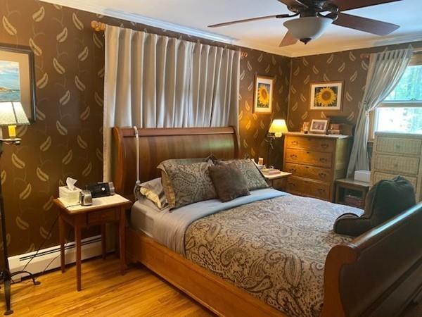 70 Cutler Road Holden, MA 01522 - Photo 13 of 28 a bed room with a bed and a chandelier