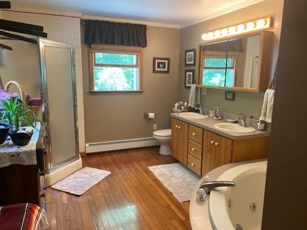 70 Cutler Road Holden, MA 01522 - Photo 14 of 28 a spacious bathroom with a granite countertop sink a toilet a mirror and vanity