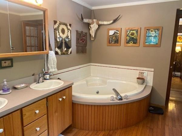 70 Cutler Road Holden, MA 01522 - Photo 15 of 28 a bathroom with a tub sink and mirror