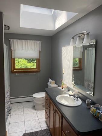 70 Cutler Road Holden, MA 01522 - Photo 20 of 28 a bathroom with a sink a toilet and mirror