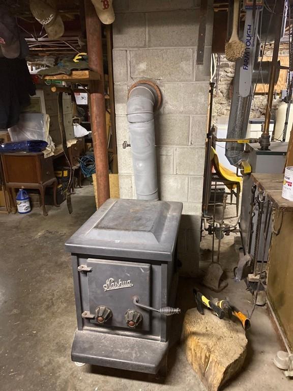 70 Cutler Road Holden, MA 01522 - Photo 25 of 28 a room with water heater and a wooden floors